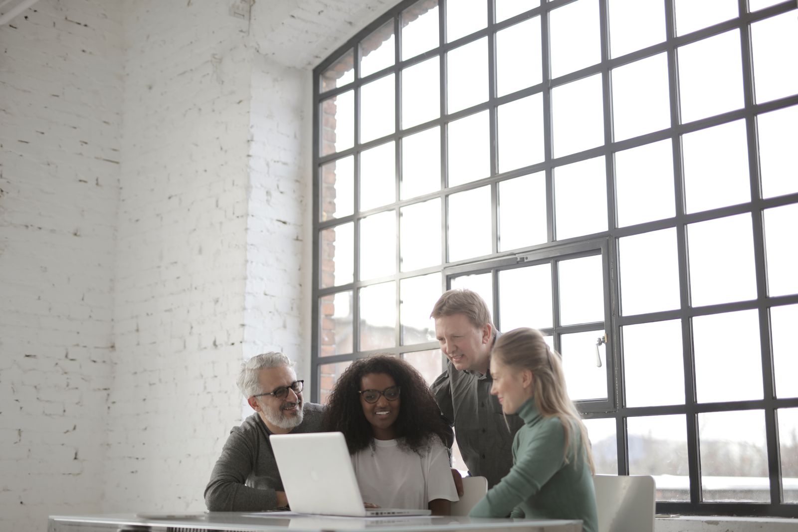 Agents reviewing market reports together