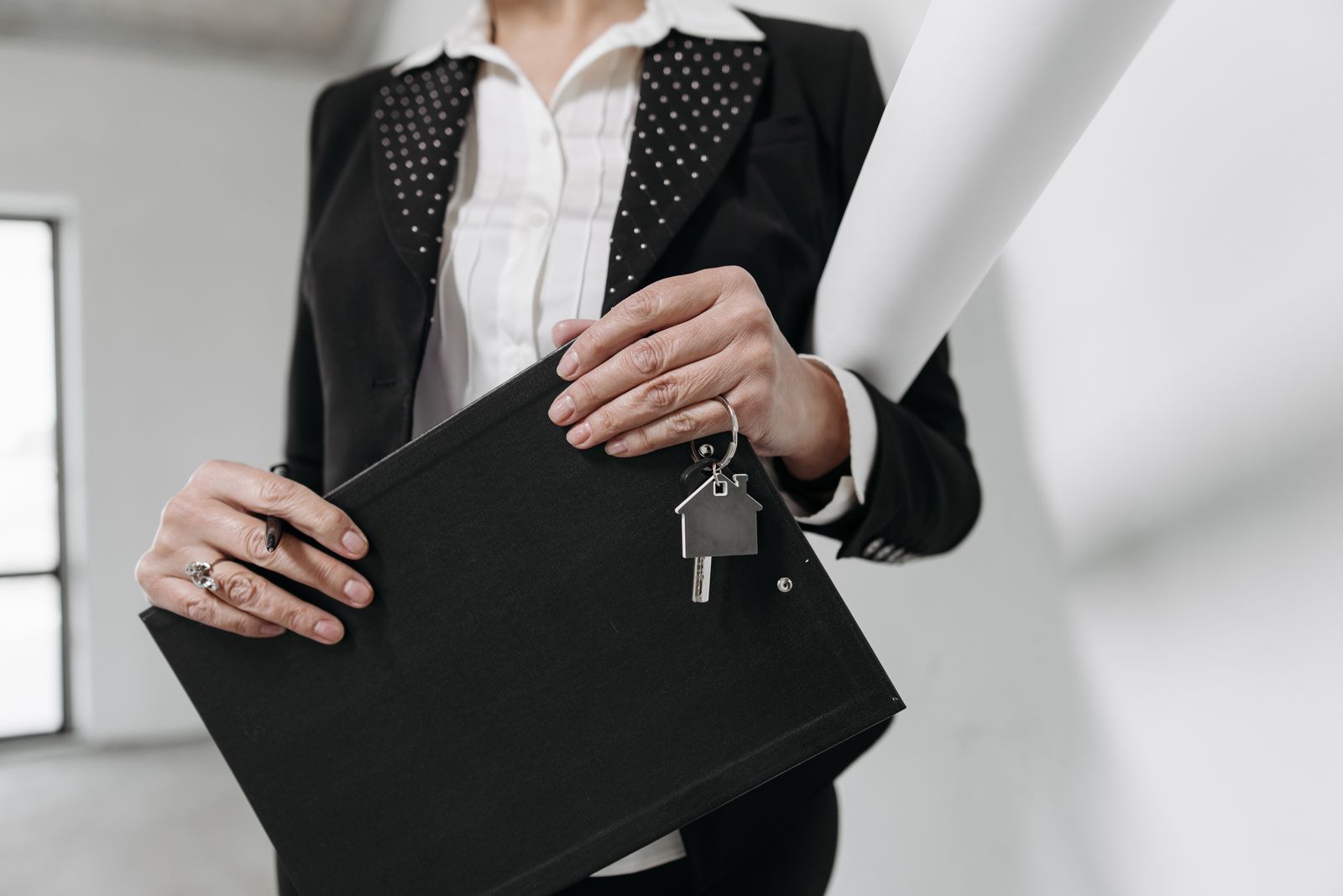 Client reviewing real estate documents at a desk