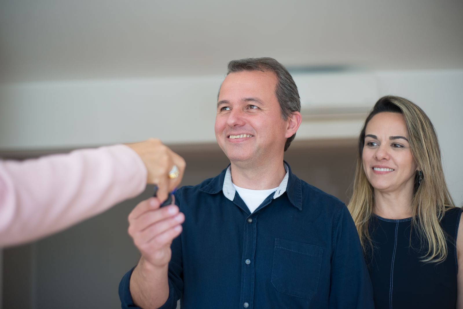 Couple holding the keys to their new home